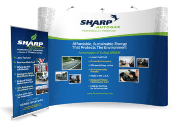 A large custom trade show display with a company logo and graphics, demonstrating exhibit and display services.
