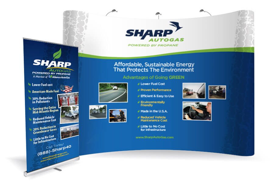 A large custom trade show display with a company logo and graphics, demonstrating exhibit and display services.