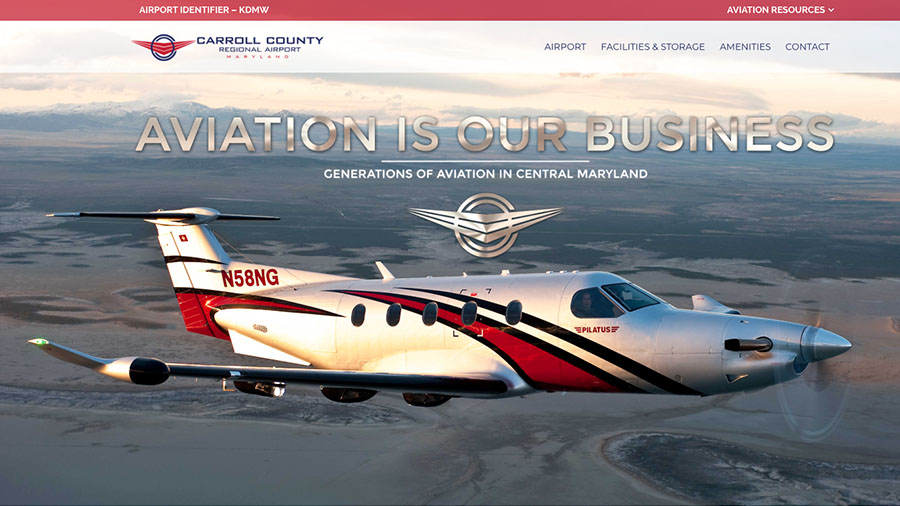 A website for Carroll County Regional Airport displayed on a desktop computer.